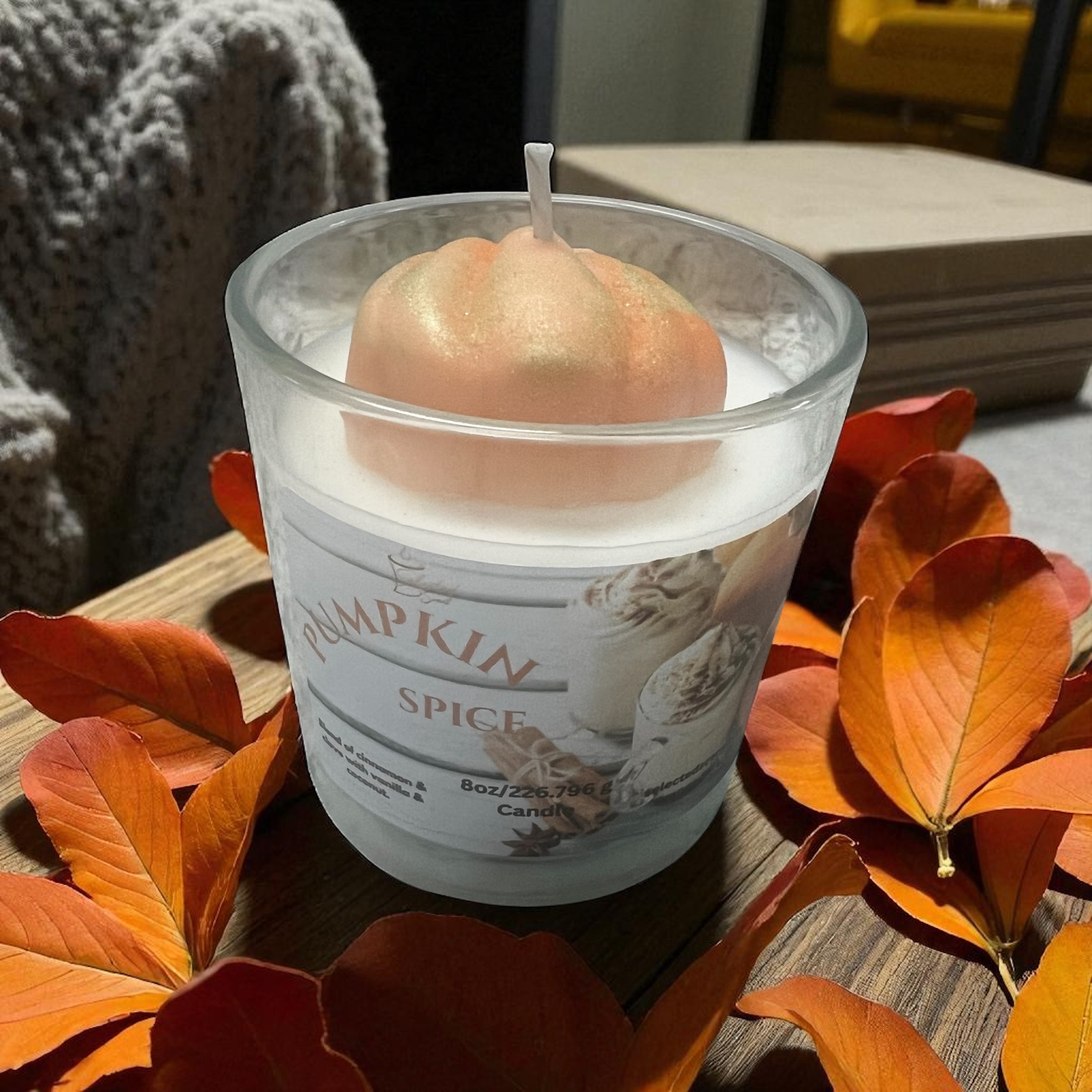 Selected Scent long lasting pumpkin candle 8oz in frosted glass with pumpkin-shaped wick and autumn leaves
