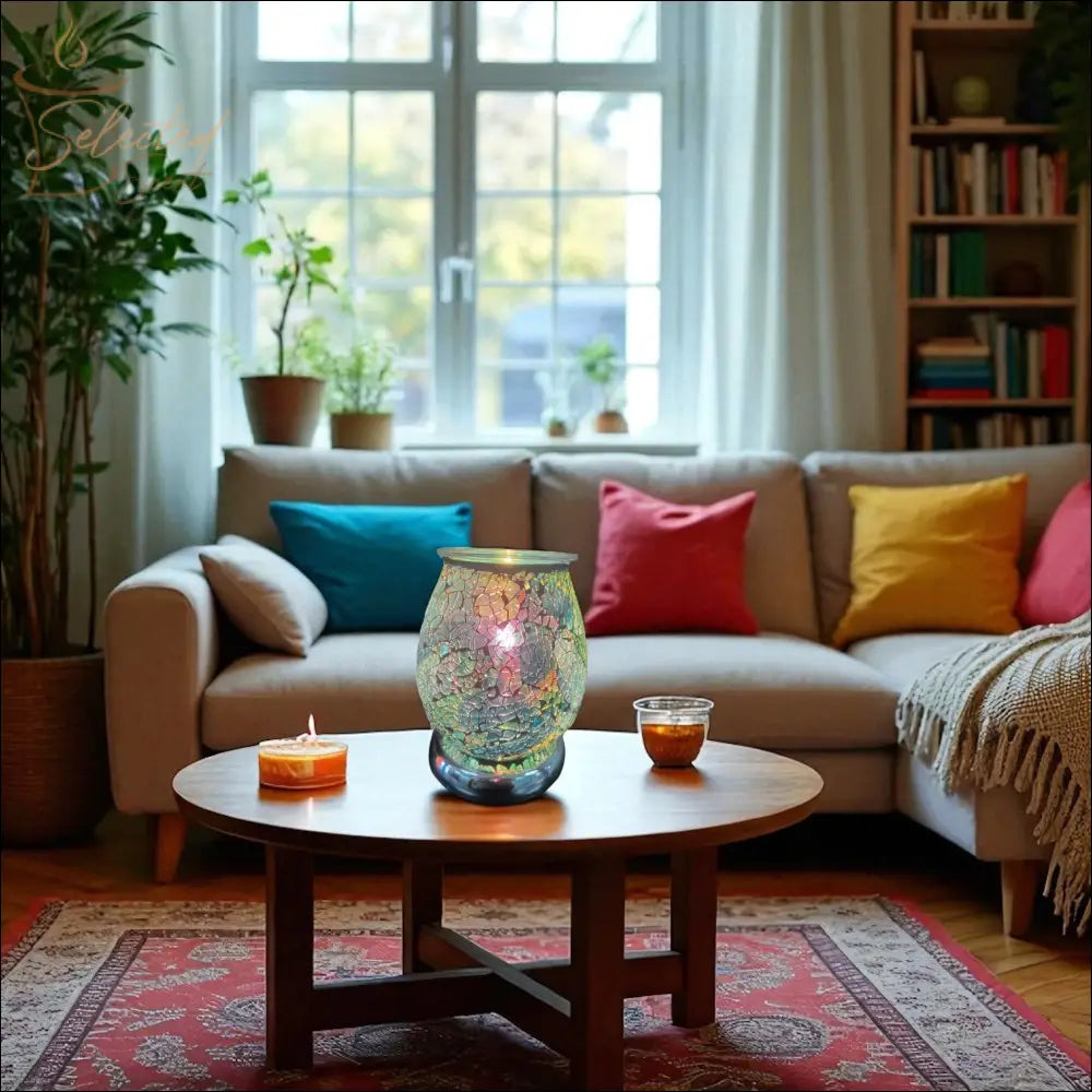 Electric Decorative Warmer with mosaic design glowing on wooden coffee table in cozy living room