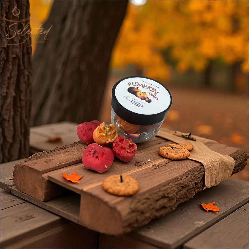 Selected Scent jar of pumpkin wax melts on rustic wood with cookies apples and fall leaves autumn scented home wax melts