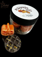 Glass jar of Selected Scent pumpkin pecan waffle wax melts showing orange pumpkin and dark waffle pieces