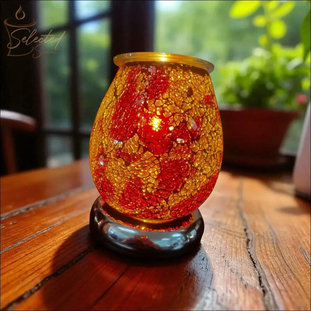 Selected Scent Electric Decorative Warmer with red and gold mosaic glass on wooden table