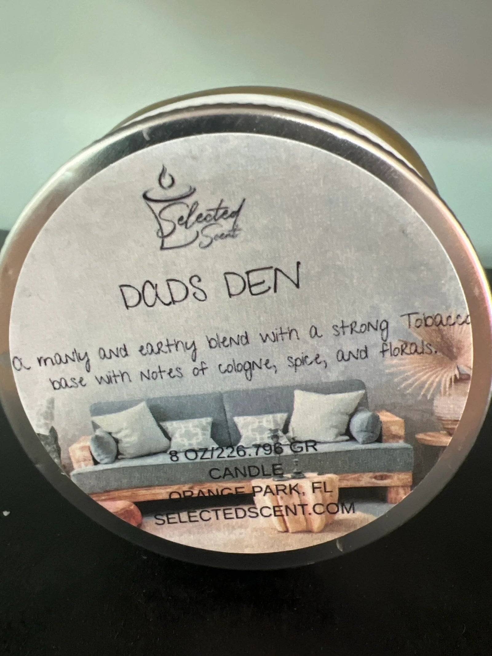 Selected Scent all natural masculine candle labeled Dads Den with earthy tobacco and floral notes