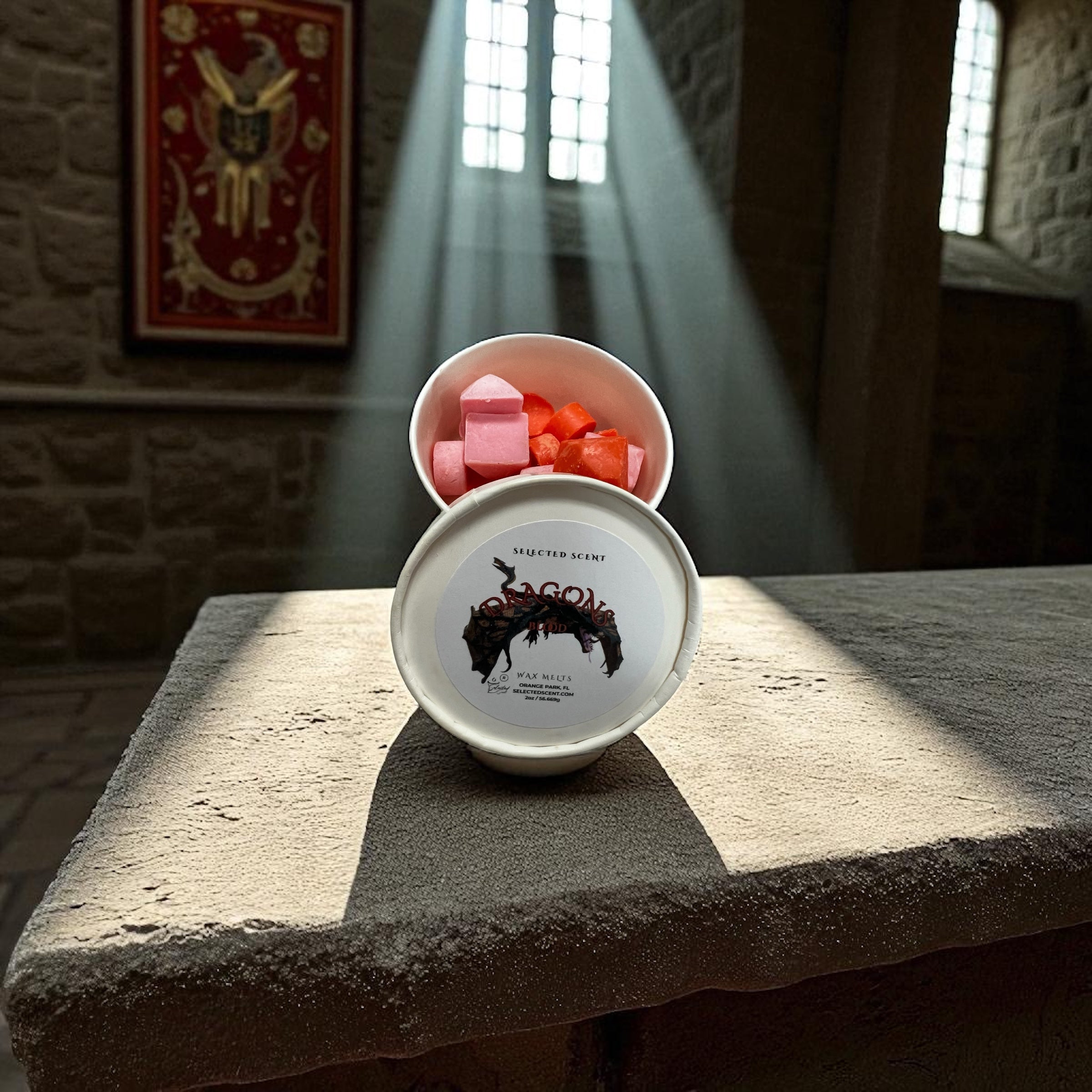 Selected Scent jar of dragons blood wax melts red cubes in white tin on stone table with sunbeams