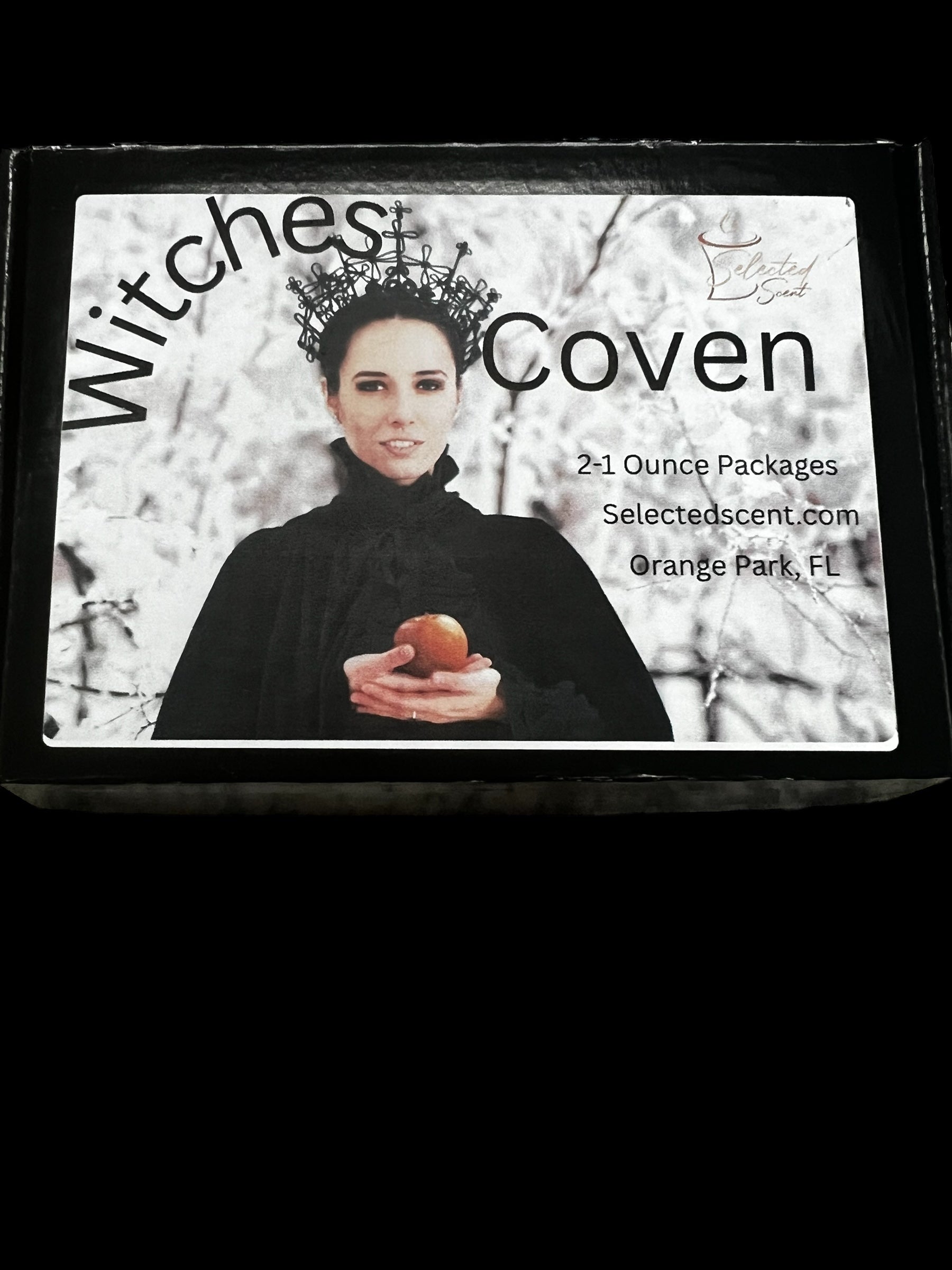 Selected Scent Witches Coven long lasting fragrance set with a woman holding an apple on the packaging