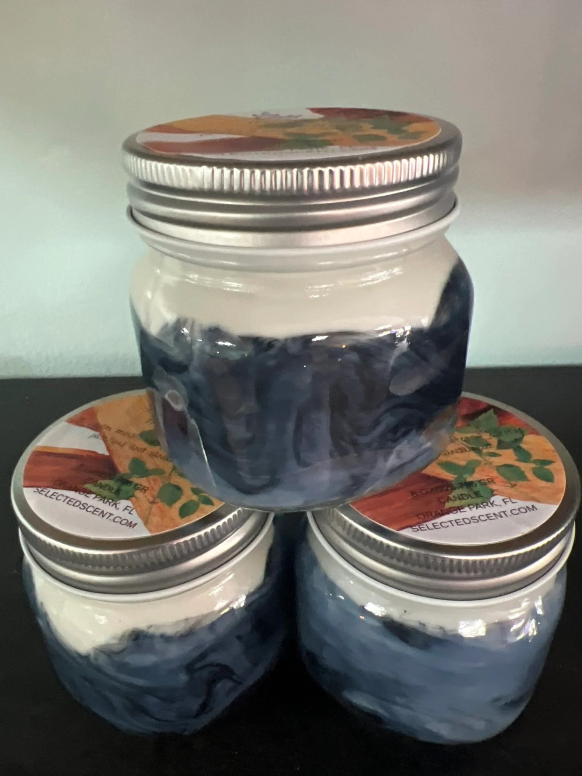 Three clear jars with silver lids containing a blue substance by Selected Scent The Choice Of Men