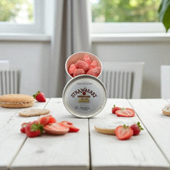Selected Scent strawberry shortcake wax melts for fragrance in a white container with fresh strawberries on a wooden table
