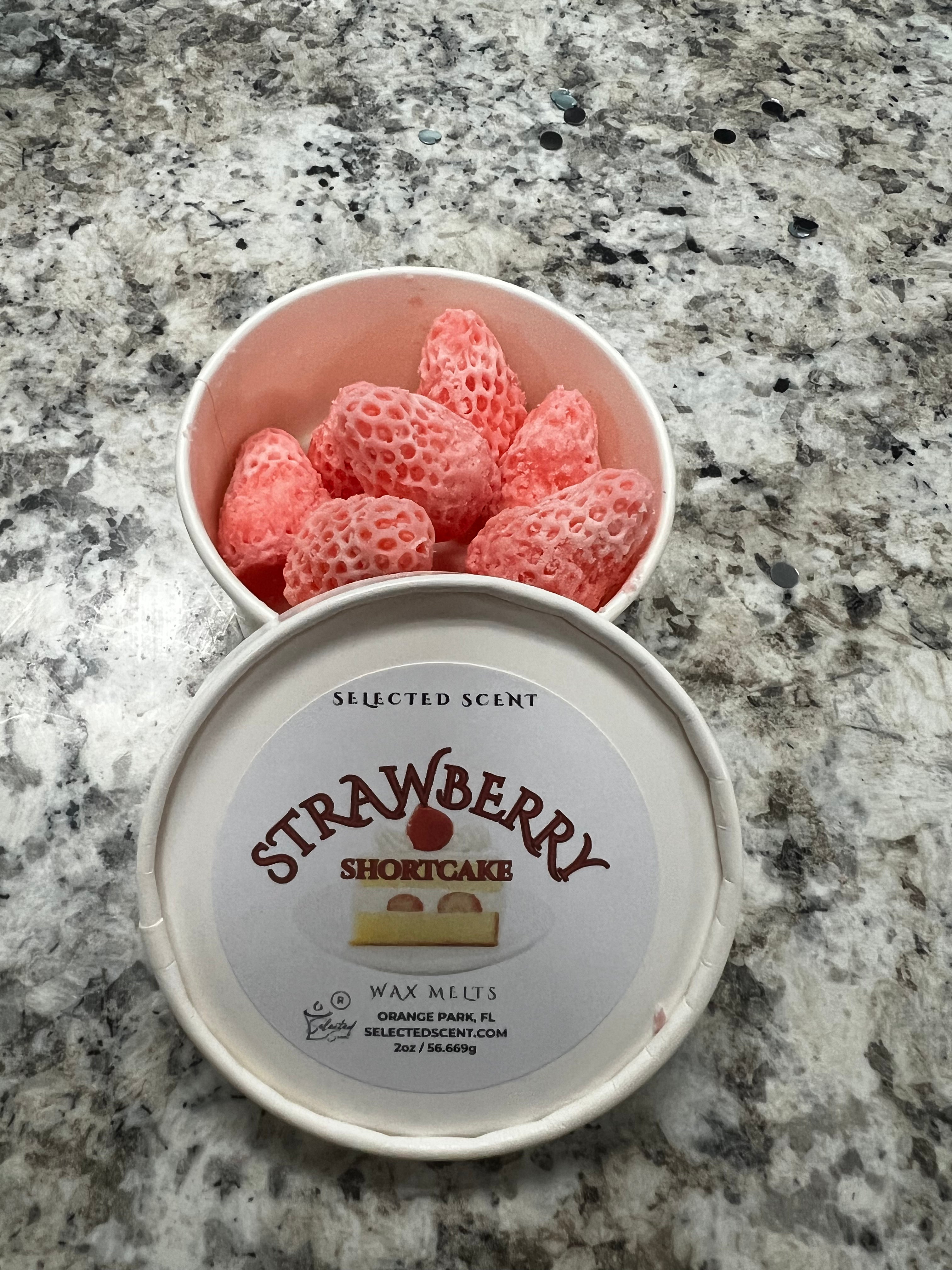 Selected Scent Strawberry Shortcake wax melts for fragrance in pink strawberry-shaped pieces with white container lid