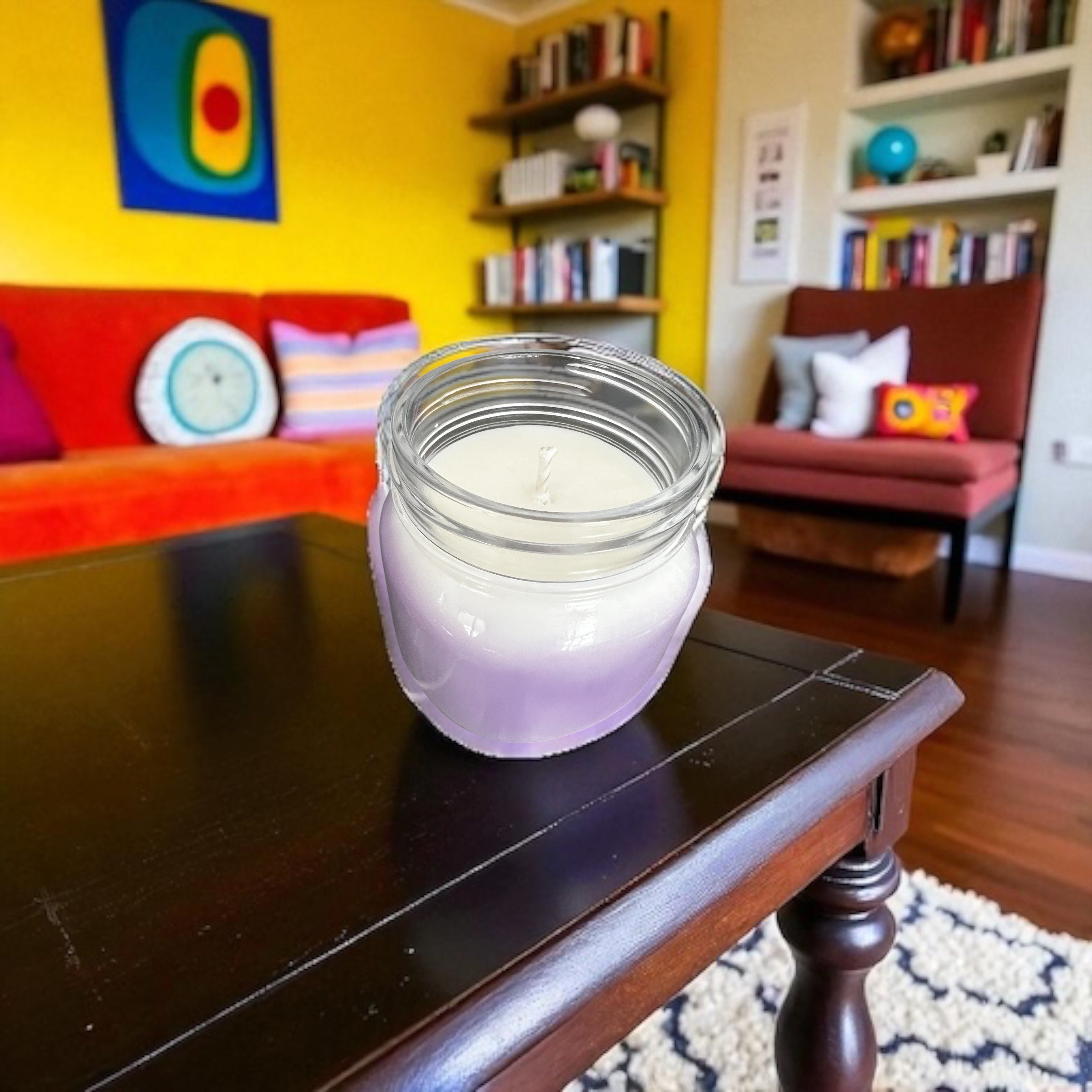 Selected Scent long lasting scented candle in a glass jar on coffee table in colorful living room