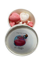Selected Scent white round tin with pink and white heart shaped and mini hearts love spell wax melts