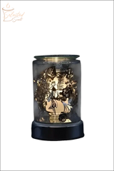 Selected Scent electric decorative warmer with intricate leaf patterns and warm glowing light
