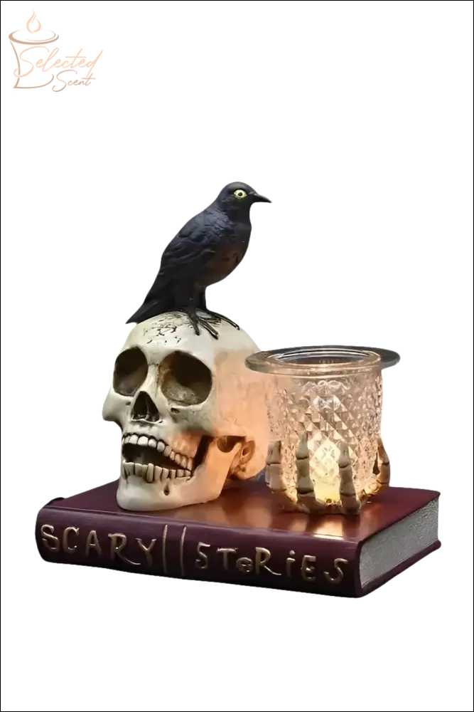 Selected Scent electric decorative warmer featuring a skull, black bird, and glass candle holder on a book base