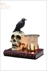 Selected Scent electric decorative warmer featuring a skull, black bird, and glass candle holder on a book base