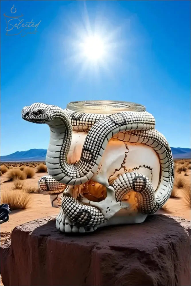 Selected Scent Electric Decorative Warmer shaped like a skull with a detailed snake design in a desert setting