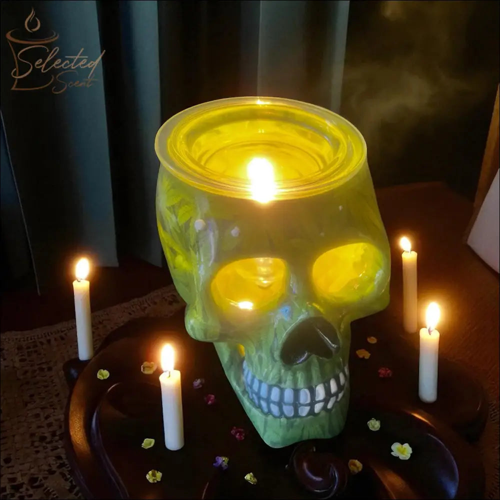 Selected Scent green skull Electric Decorative Warmer with candles on dark wooden table