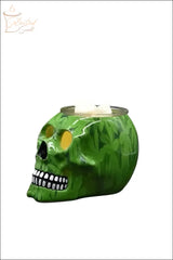 Green skull-shaped Electric Decorative Warmer with leaf pattern and white wax melts on top