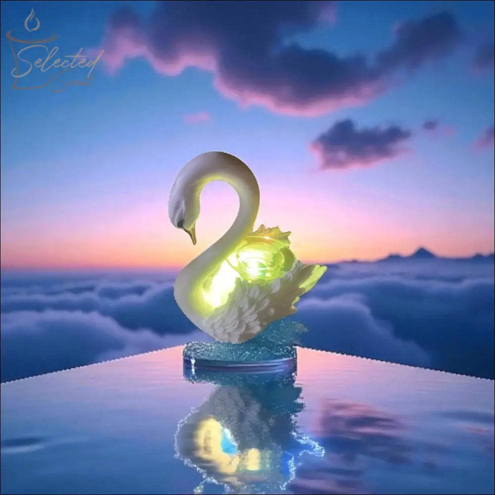 Selected Scent electric decorative warmer shaped like a glowing swan on reflective surface at sunset