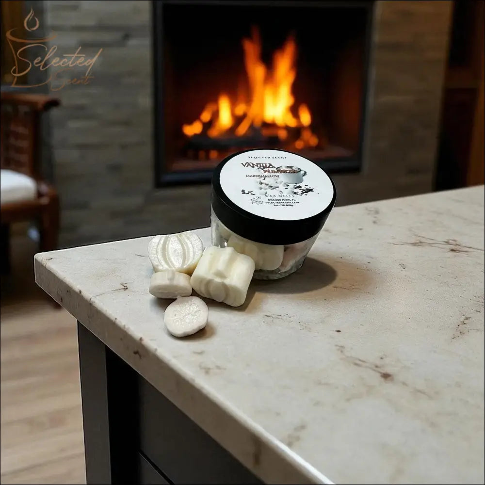 Selected Scent jar of vanilla pumpkin marshmallow wax melts on marble counter by cozy fireplace