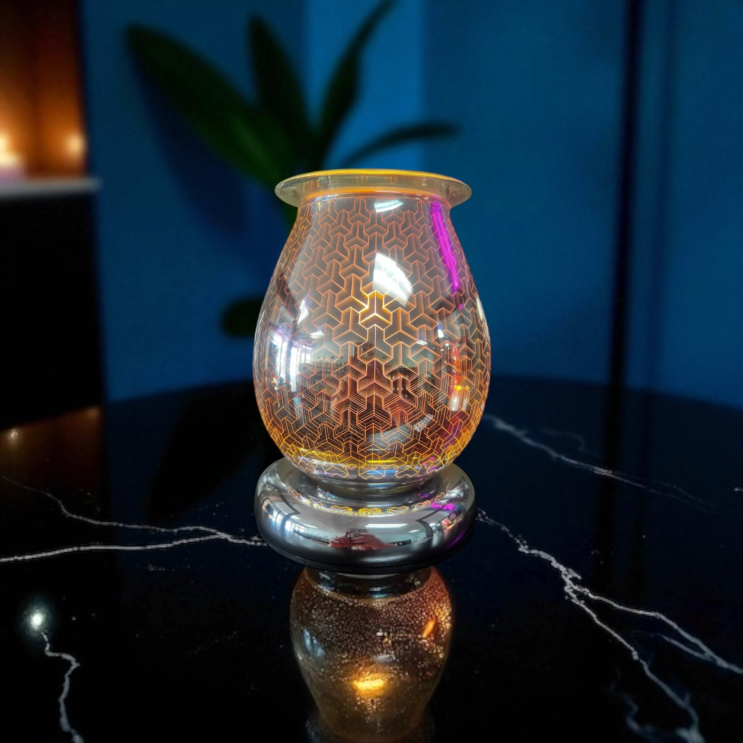 Selected Scent Electric Decorative Warmer with geometric patterned glass and reflective base on black marble surface