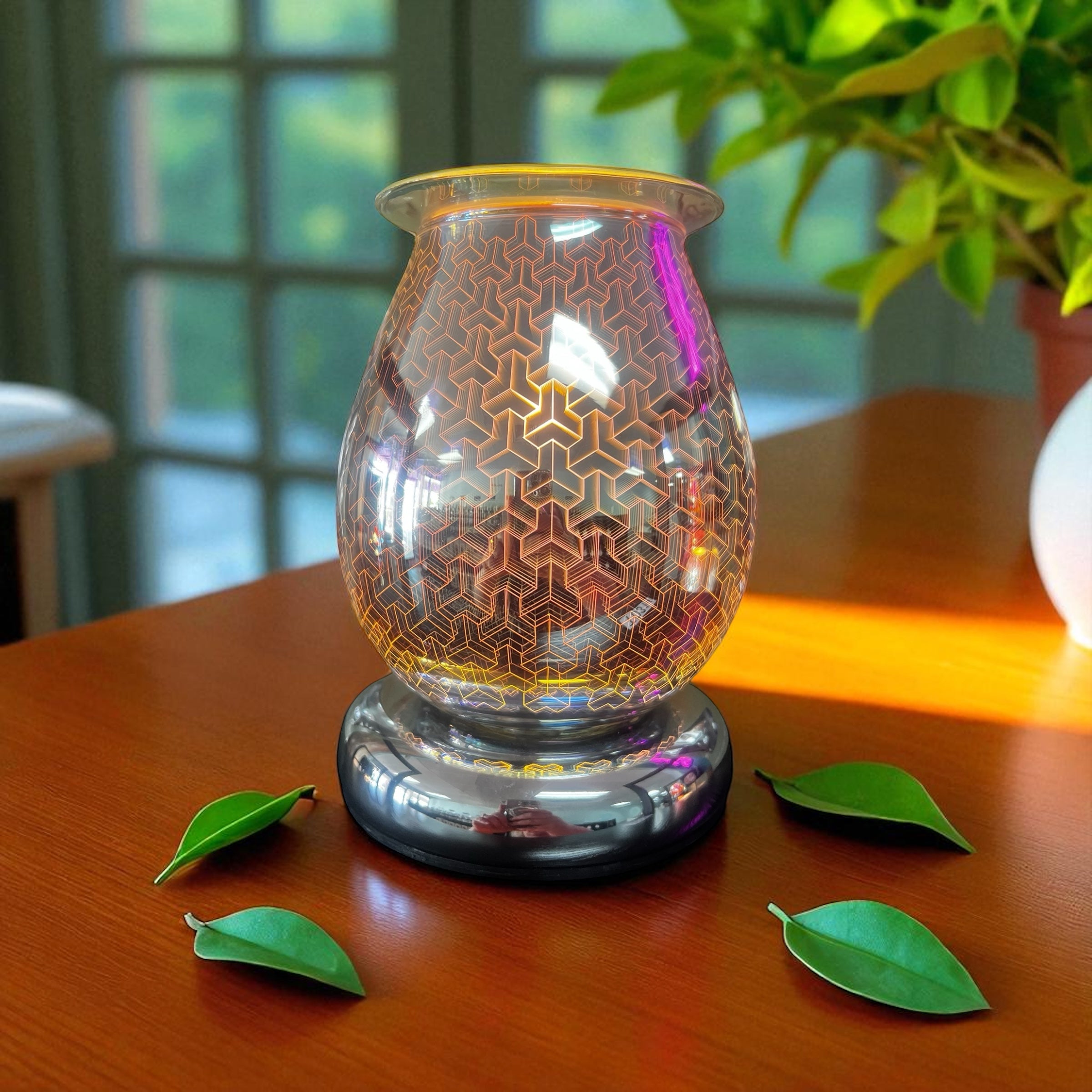 Selected Scent Electric Decorative Warmer with geometric glass design on wooden table with green leaves