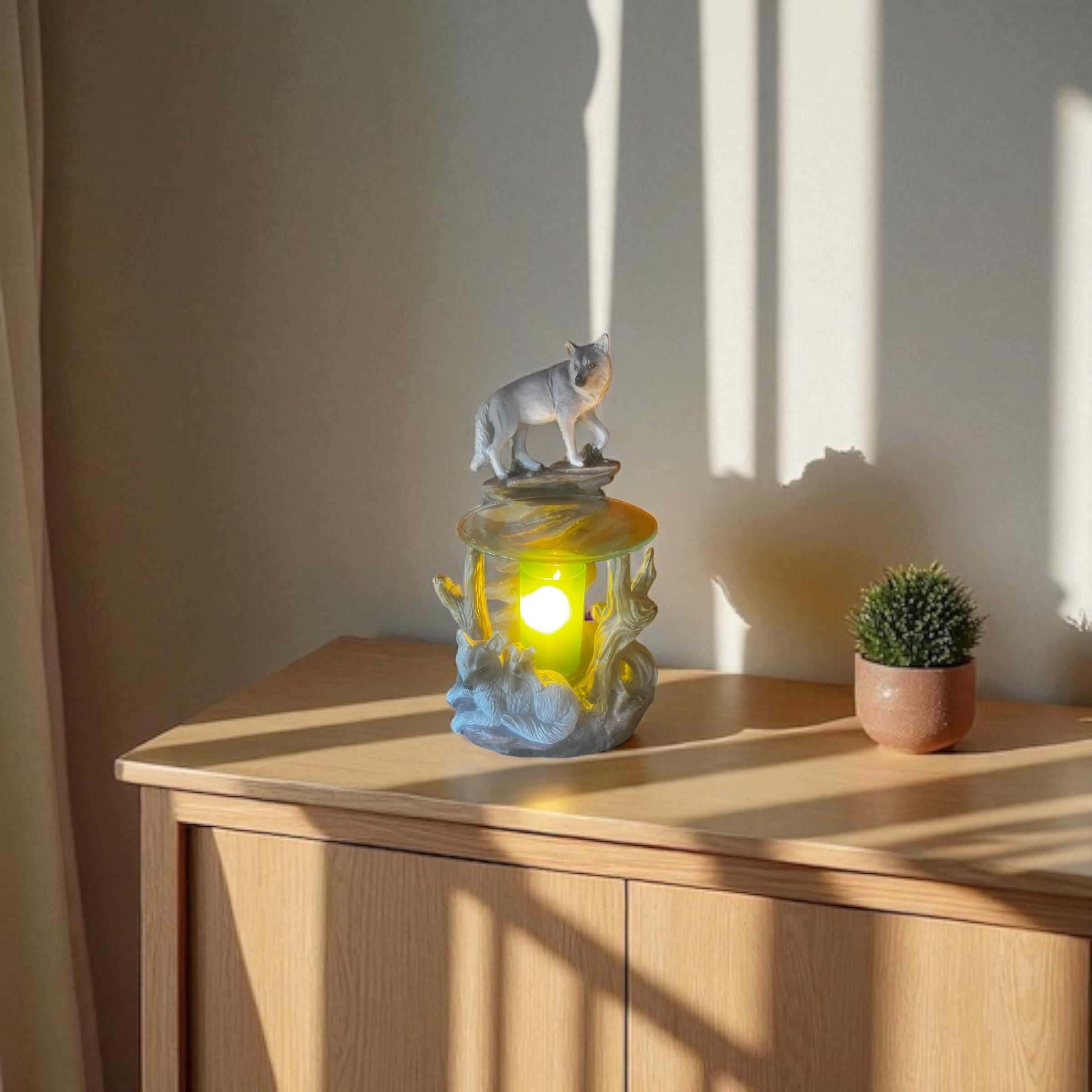 Selected Scent Electric Decorative Warmer with wolf design on wooden cabinet beside small plant