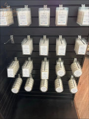 Selected Scent wax melts display with Stronger Fragrance Utilizing Coconut Wax Blend in various scents on black rack
