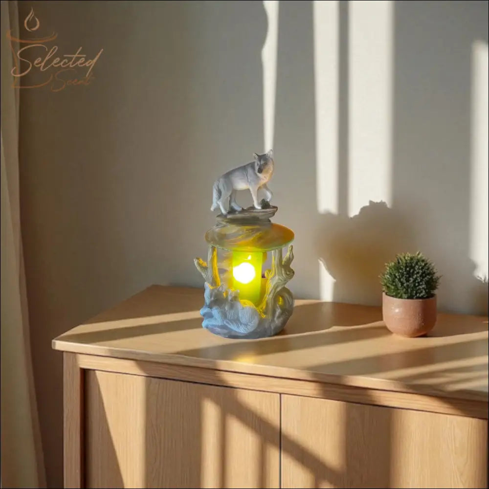 Selected Scent Electric Decorative Warmer with wolf design on wooden cabinet beside small plant